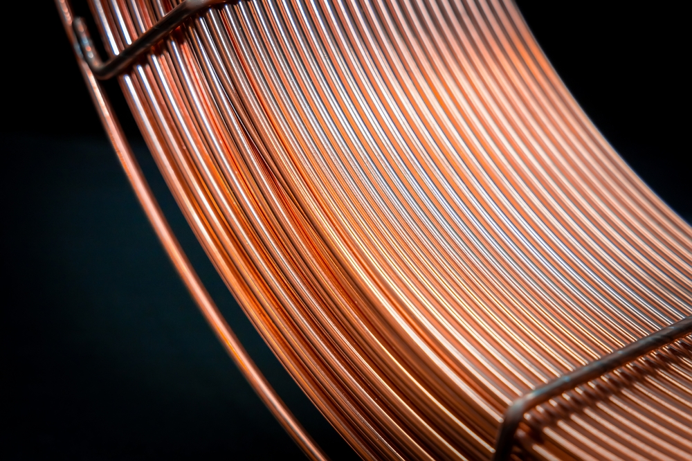 Elegantly,Curved,Copper,Wires,On,Dark,Background,,Industrial,Beauty.,Coil