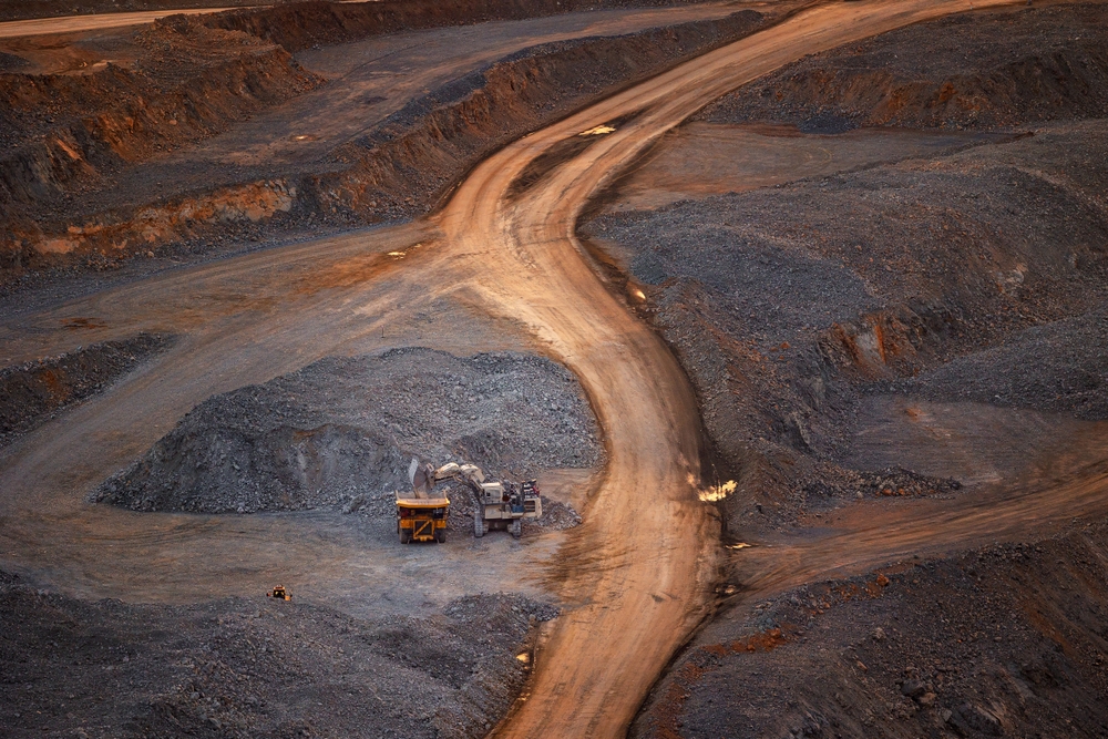 Aerial,View,Industry,Work,Of,Trucks,And,Excavator,In,Open